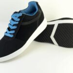 A pair of trendy black sneakers featuring blue laces and a comfortable design, perfect for casual outings.